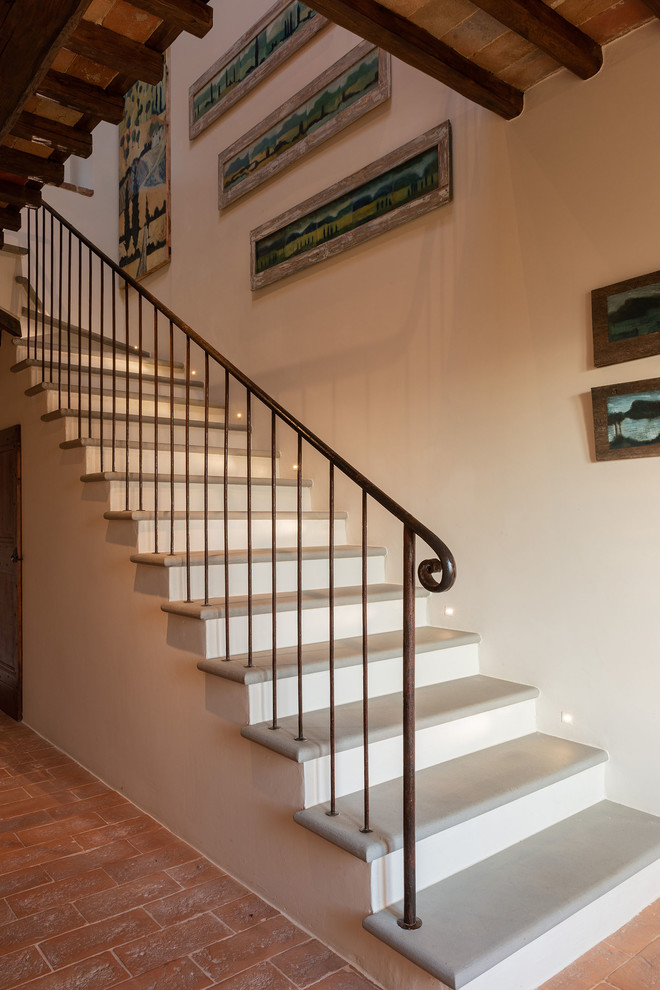 Staircase - large cottage limestone l-shaped metal railing staircase idea in Other