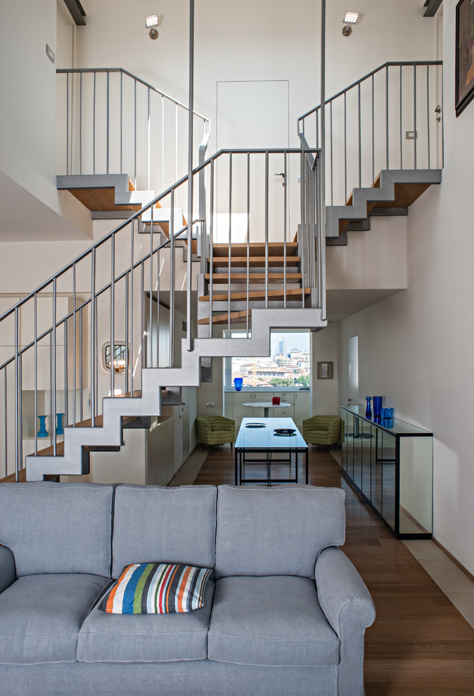 Inspiration for a medium sized contemporary wood l-shaped staircase in Milan with open risers.