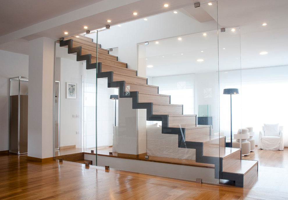 Inspiration for a contemporary wood straight staircase in Rome with wood risers and feature lighting.