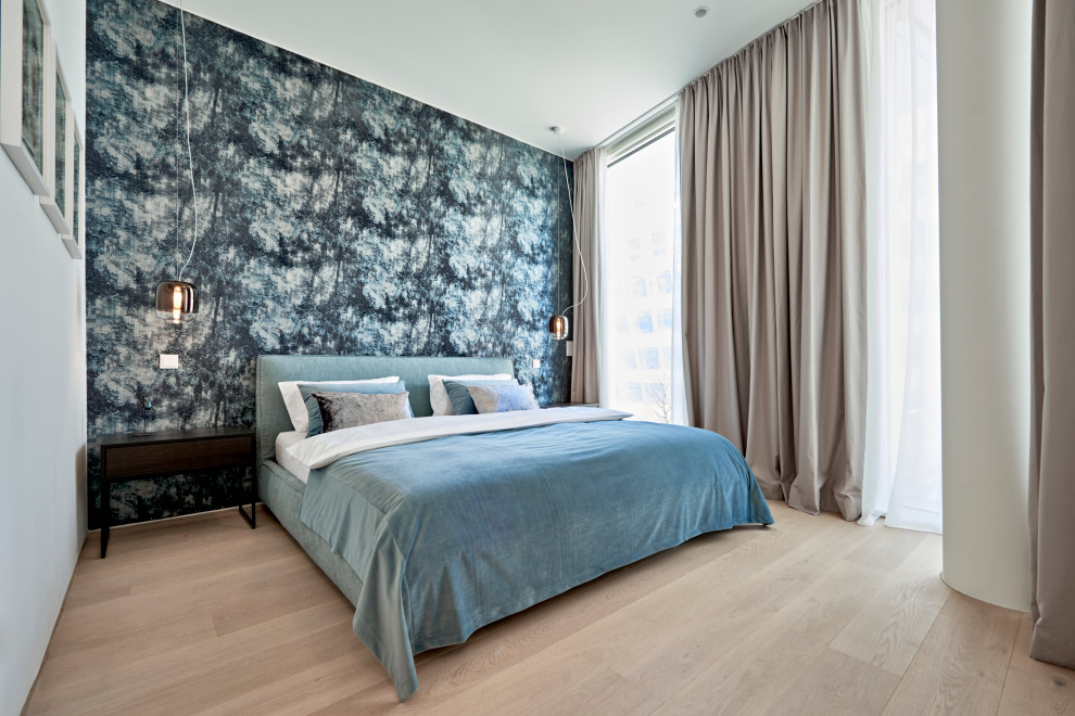 Medium sized contemporary master bedroom in Hamburg with light hardwood flooring and beige floors.
