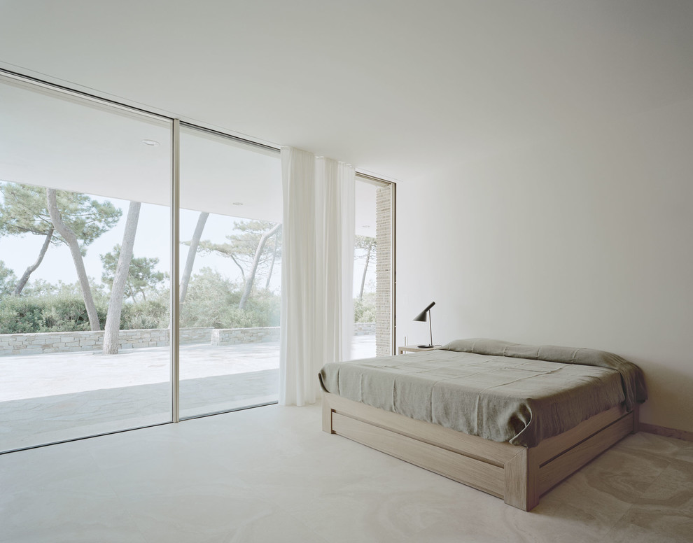 Large contemporary master bedroom in Other with white walls and marble flooring.