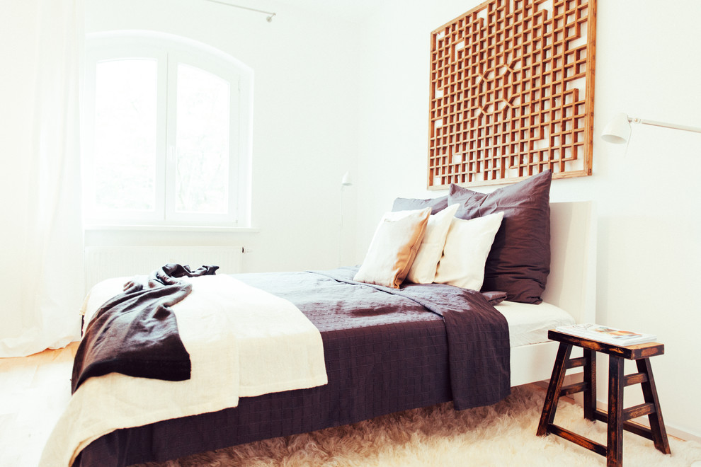 Inspiration for a mid-sized zen master carpeted bedroom remodel in Berlin with white walls and no fireplace