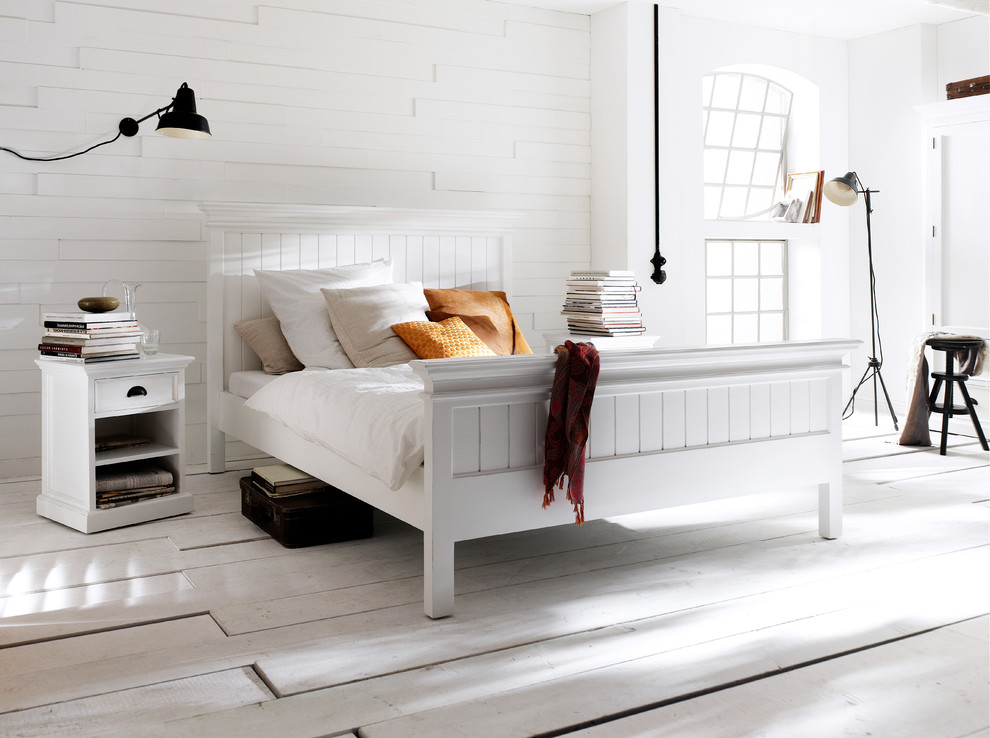 Diseño de dormitorio contemporáneo de tamaño medio con paredes blancas y suelo de madera clara
