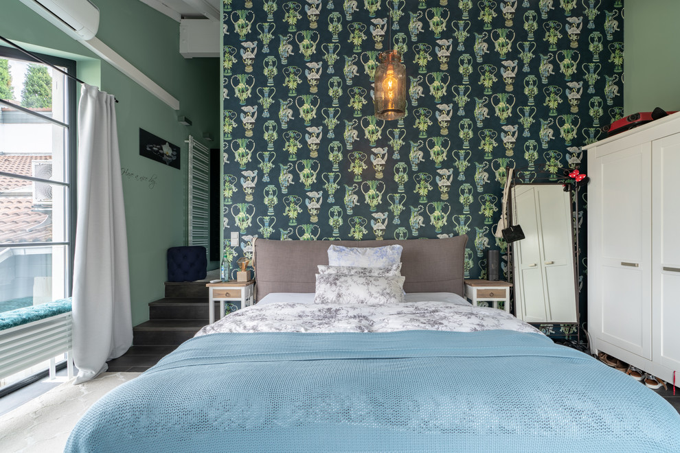 This is an example of a contemporary bedroom in Dusseldorf with green walls.