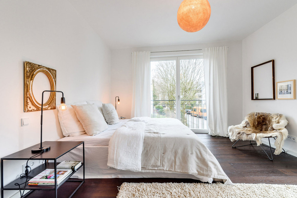Design ideas for a medium sized scandinavian master bedroom in Munich with white walls, dark hardwood flooring, no fireplace and brown floors.