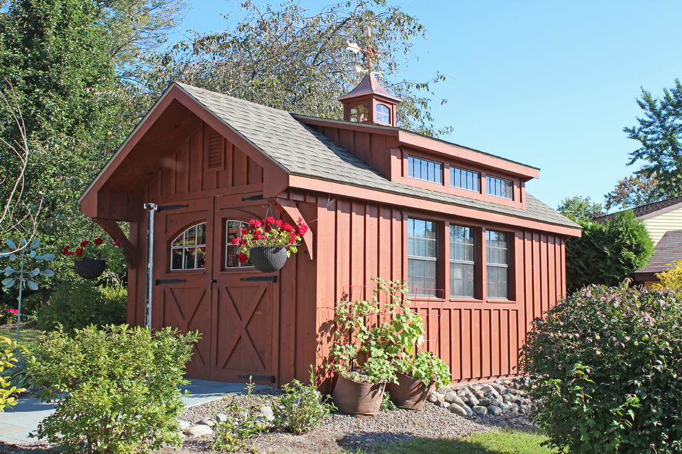 Example of a mid-sized detached garden shed design in Other