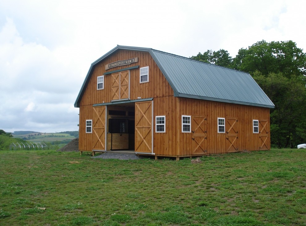 Example of a large country detached barn design in Other