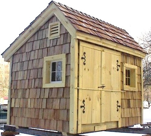 Inspiration for a small rustic detached garden shed and building in Providence.