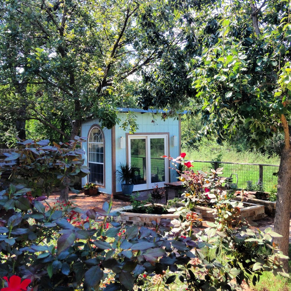 This is an example of a beach style garden shed and building in Austin.