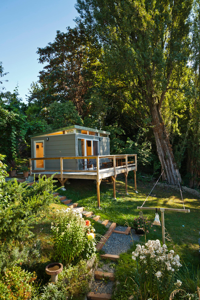 Example of a mid-sized minimalist detached guesthouse design in Seattle