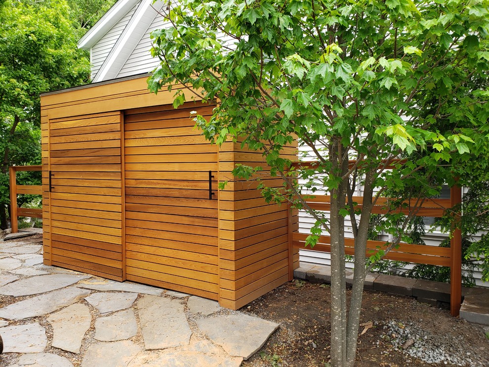 Photo of a medium sized modern detached garden shed and building in Boston.