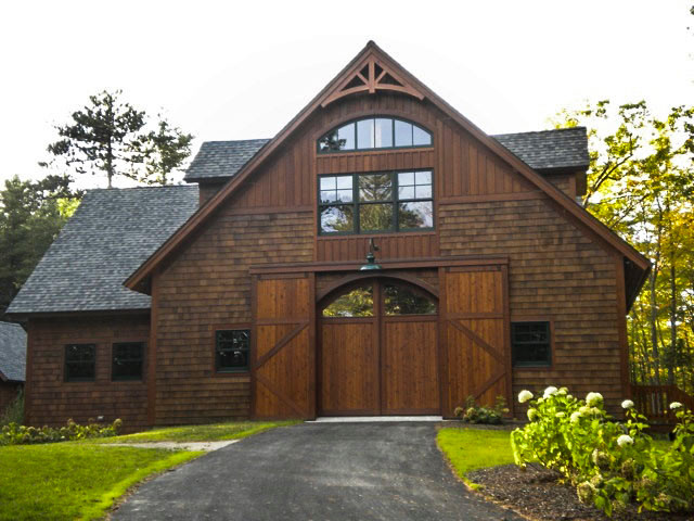 Example of a large arts and crafts detached barn design in Boston