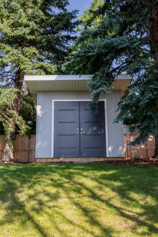 This is an example of a large contemporary detached garden shed in Calgary.