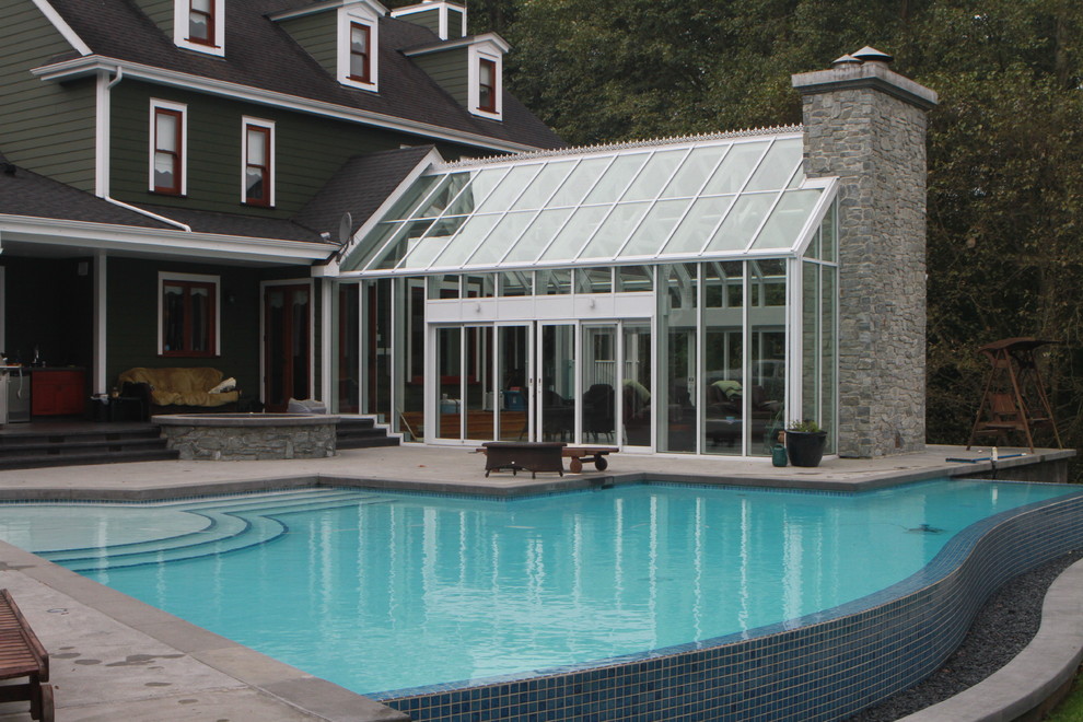 Photo of a large contemporary attached greenhouse in Vancouver.