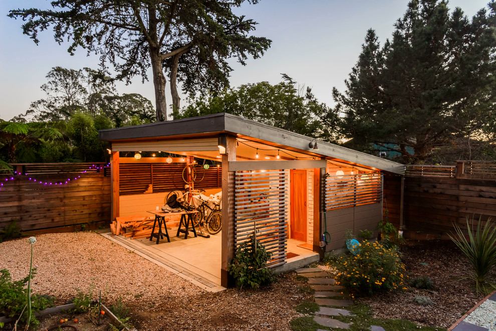Idées déco pour un abri de jardin séparé contemporain avec un bureau, studio ou atelier.