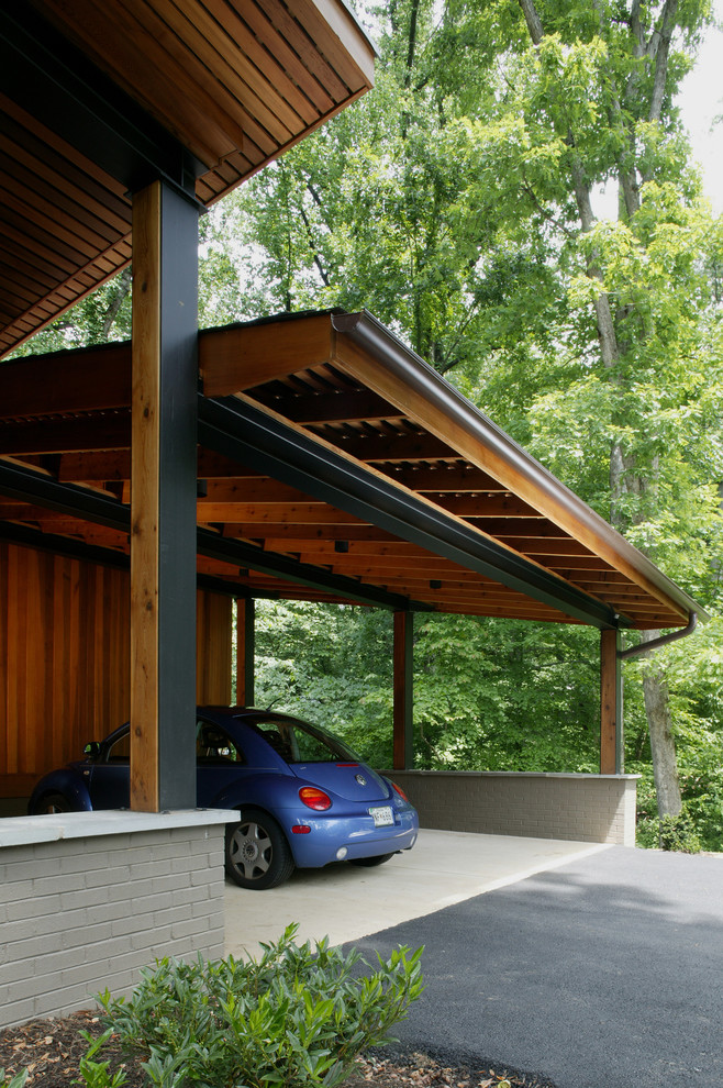 Esempio di garage e rimesse connessi moderni di medie dimensioni