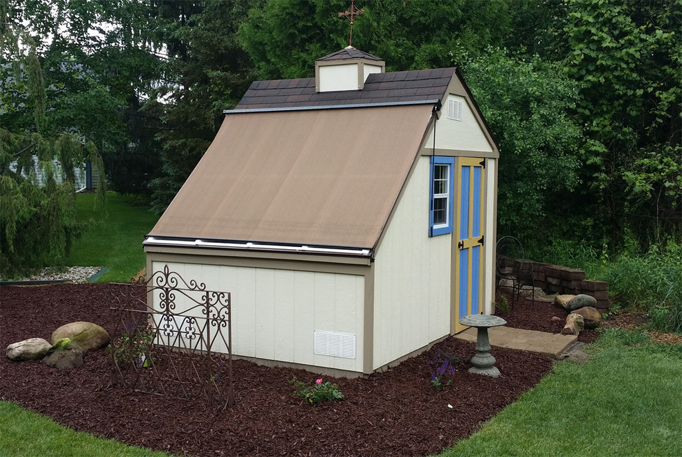 This is an example of a medium sized contemporary detached garden shed in Detroit.