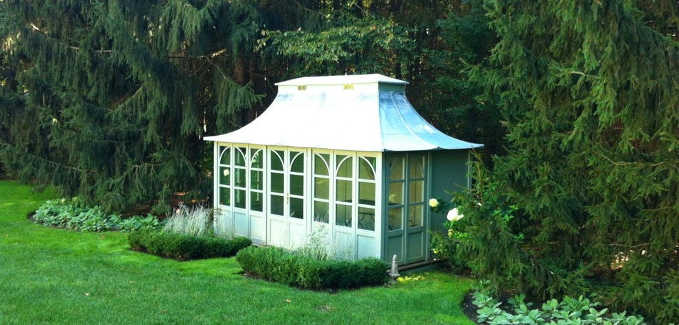 Inspiration for a medium sized classic detached garden shed in Minneapolis.