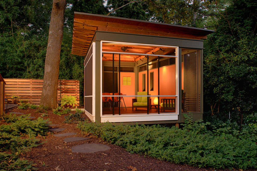 This is an example of a medium sized contemporary garden shed and building in Atlanta.