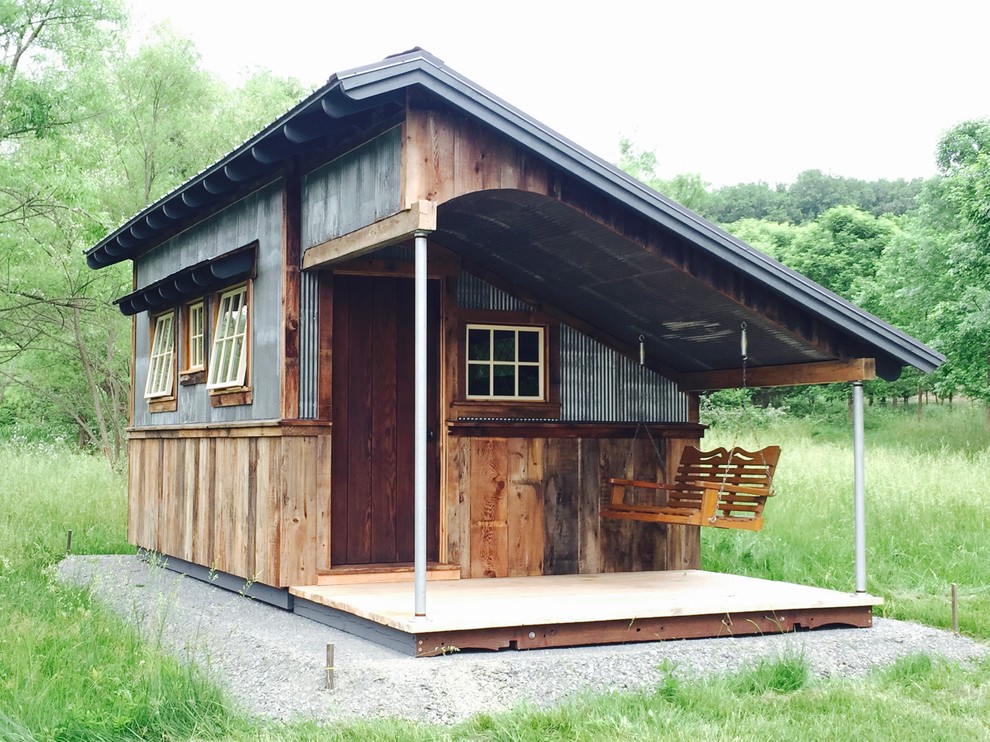 Inspiration for a mid-sized rustic detached shed remodel in Other