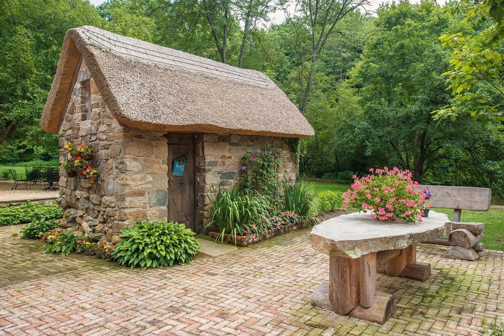 Photo of a medium sized rustic detached garden shed in New York.