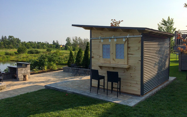 modern bar shed with sliding barn door an siding windows