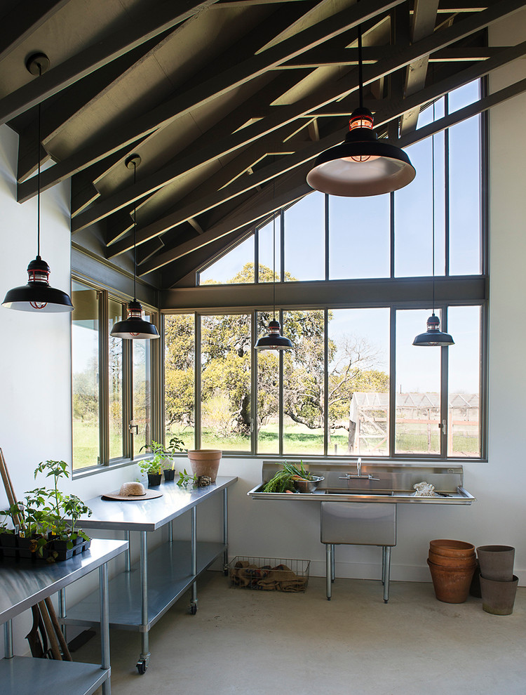 Mid-sized urban attached garden shed photo in Austin