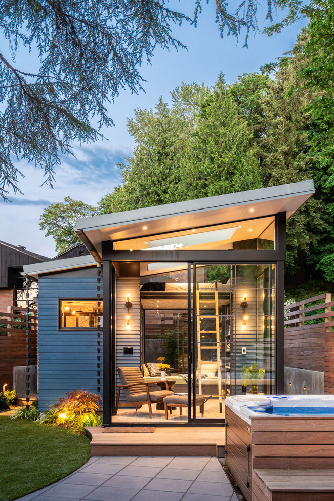 Photo of a contemporary detached guesthouse in Seattle.