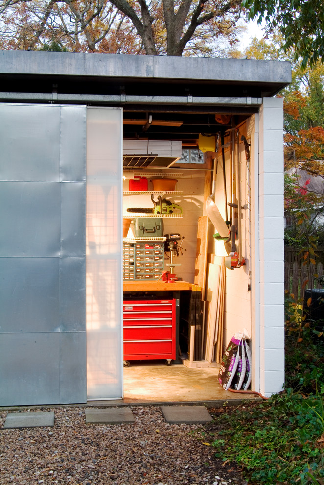 This is an example of a small modern detached garden shed in Raleigh.
