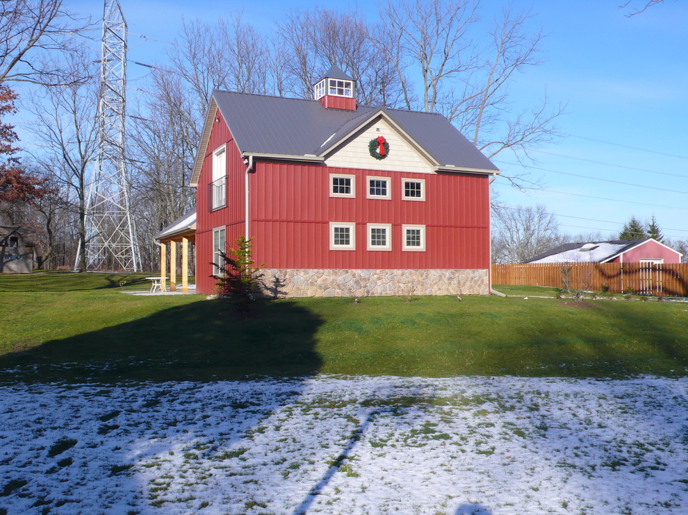 Example of a large cottage detached barn design in Detroit