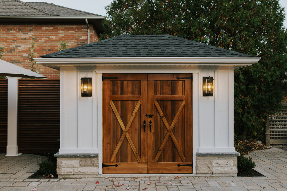 Mid-sized farmhouse detached shed photo in Toronto