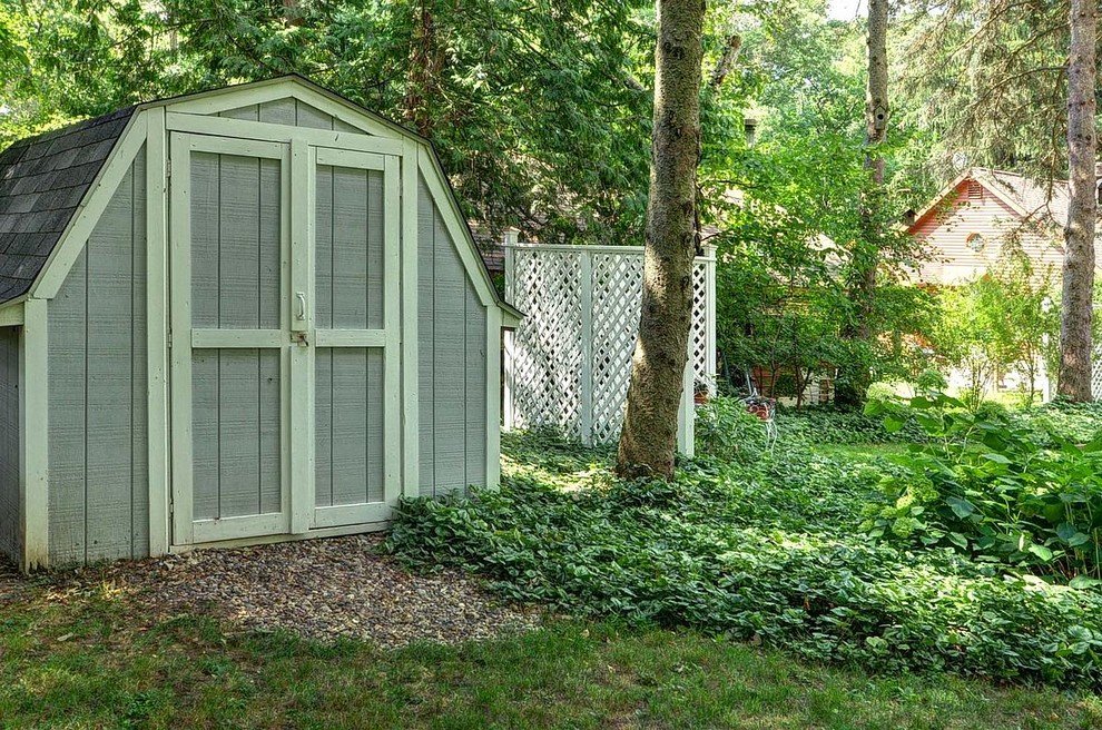 Inspiration for a medium sized coastal detached garden shed in Milwaukee.