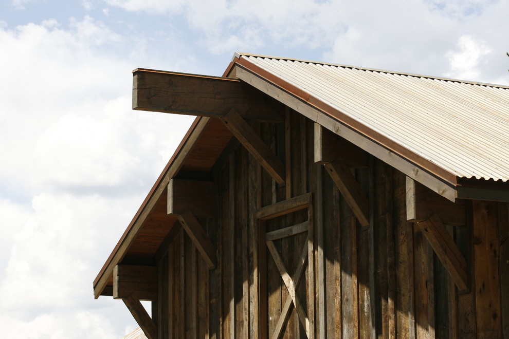 Large mountain style detached barn photo in Denver