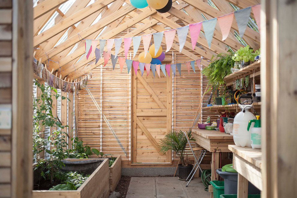 Example of a small country detached garden shed design in Montreal