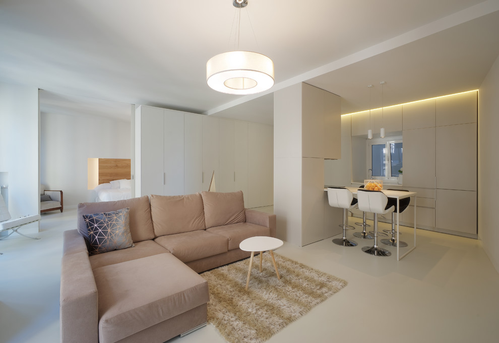 Photo of a contemporary open plan games room in Other with white walls, concrete flooring and grey floors.