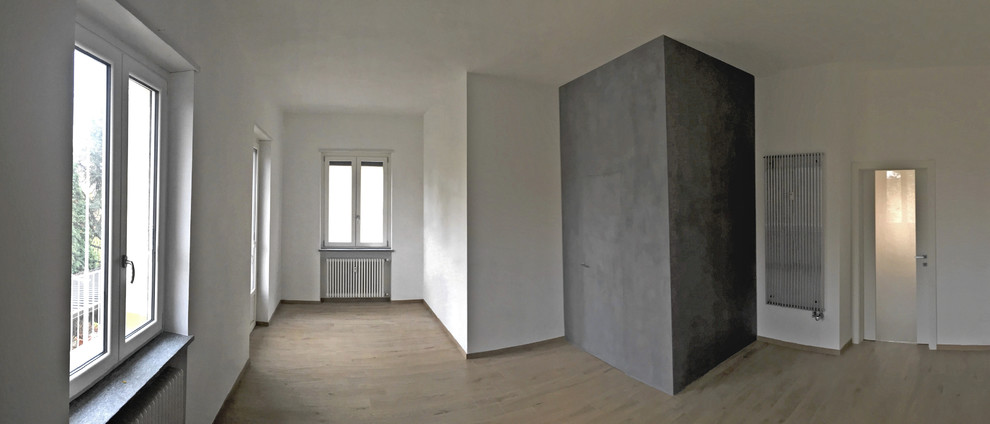 Ispirazione per un soggiorno minimal aperto con pavimento in gres porcellanato e pareti bianche