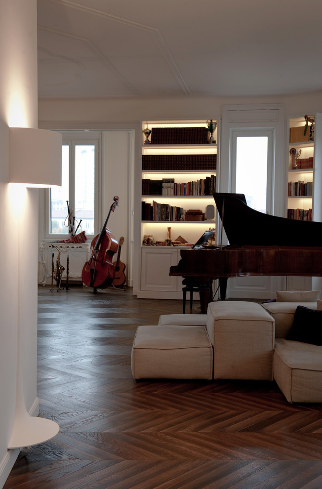 На фото: большая открытая гостиная комната в стиле модернизм с музыкальной комнатой, белыми стенами, темным паркетным полом, горизонтальным камином, фасадом камина из штукатурки, скрытым телевизором и коричневым полом с