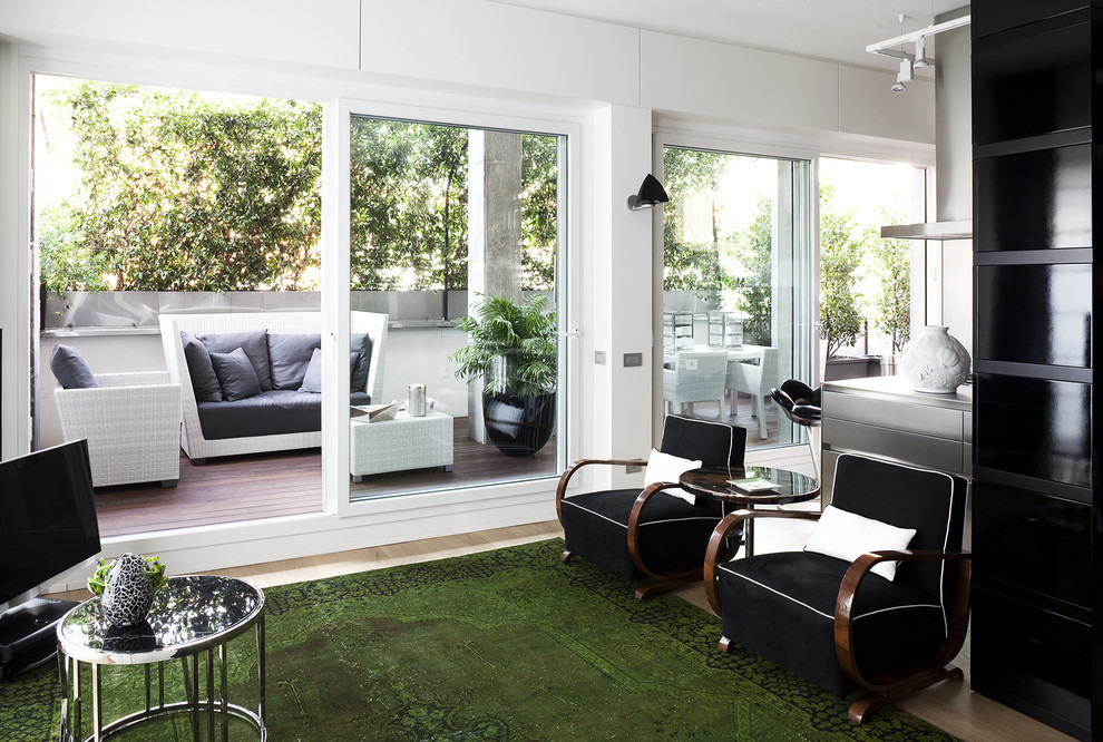 Immagine di un soggiorno minimal aperto con sala formale e pareti bianche