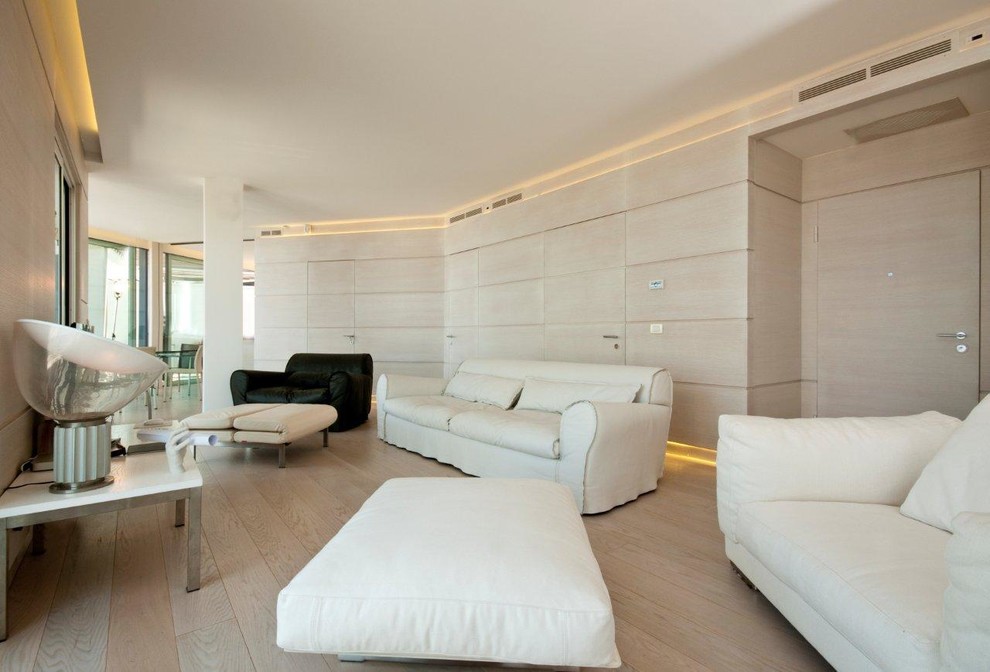 Design ideas for an expansive contemporary open plan games room in Bologna with light hardwood flooring.