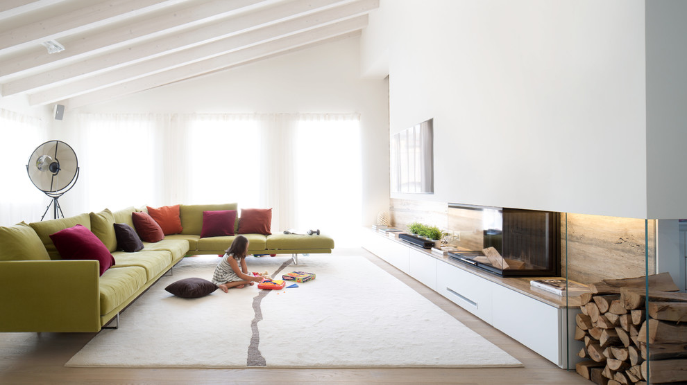 Trendy light wood floor family room photo in Other with white walls, a ribbon fireplace and a wall-mounted tv