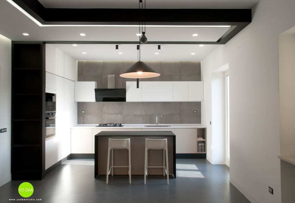Ispirazione per una cucina contemporanea di medie dimensioni con pavimento in cemento e pavimento grigio