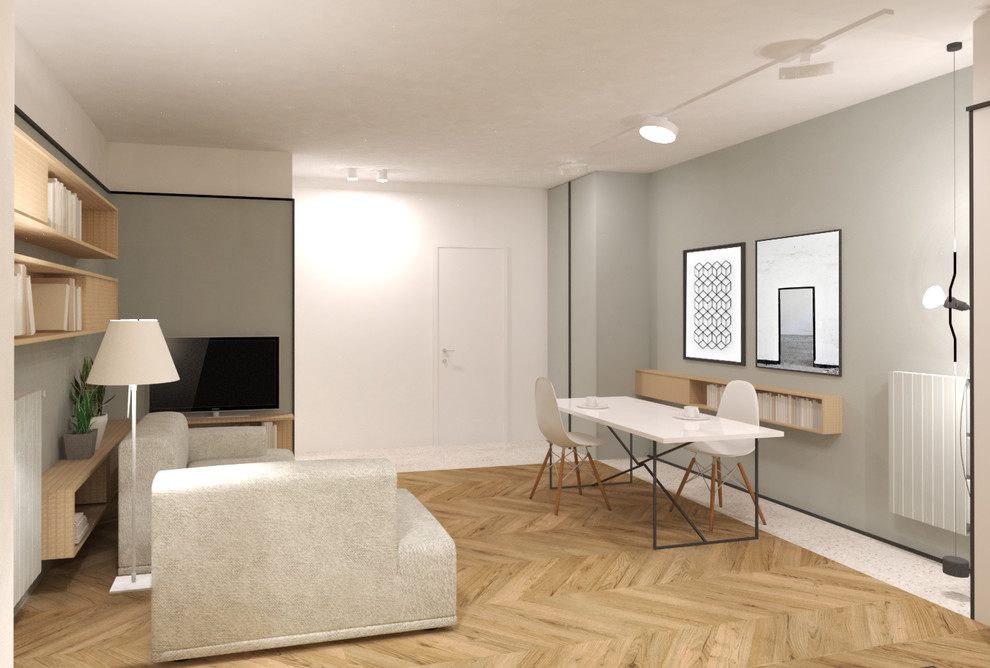 Foto di un soggiorno minimal di medie dimensioni e aperto con libreria, pareti verdi, parquet chiaro, TV a parete e pavimento beige