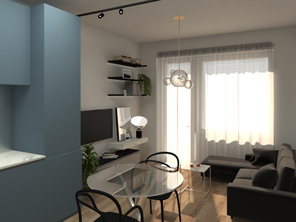 Foto di un piccolo soggiorno bohémian aperto con pareti grigie, pavimento in legno massello medio e TV a parete