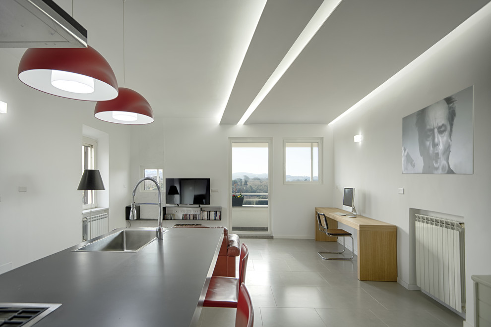 Immagine di un piccolo soggiorno design con pareti bianche, pavimento in gres porcellanato, TV autoportante e pavimento grigio