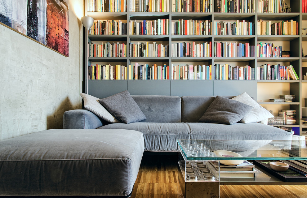 Inspiration pour une salle de séjour design de taille moyenne et fermée avec une bibliothèque ou un coin lecture.