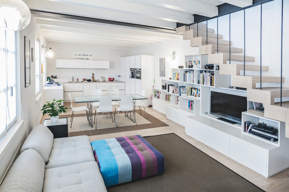 Medium sized contemporary open plan living room in Other with white walls, light hardwood flooring, a built-in media unit and beige floors.