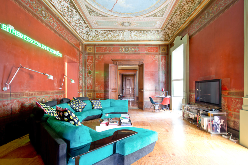 Design ideas for a large bohemian enclosed games room in Naples with red walls, a freestanding tv, medium hardwood flooring and no fireplace.