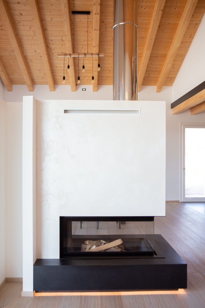 Foto di un grande soggiorno minimalista stile loft