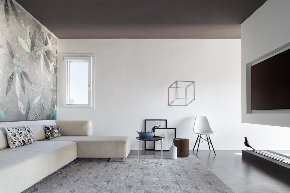 Immagine di un soggiorno scandinavo con TV a parete