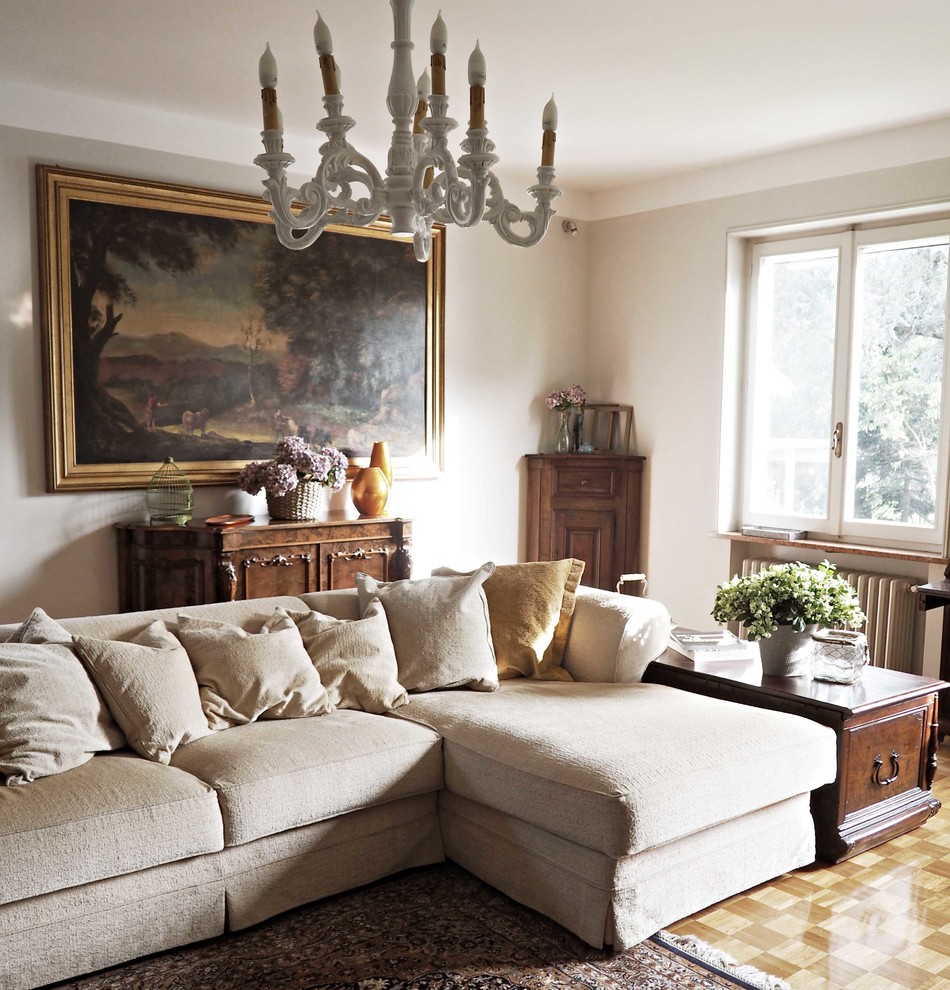 Living room - large traditional formal painted wood floor living room idea in Bologna with beige walls
